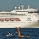It’s not every day you find a Getty Images picture of the cruise ship you’re writing a story about that also has an awesome paddleboarding dog in it.